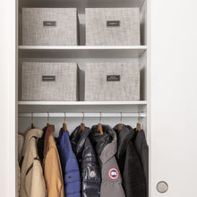 Load image into Gallery viewer, coat closet with light grey fabric bins organized with black removable pre-printed labels