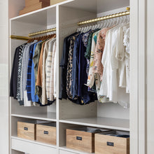 Load image into Gallery viewer, women's clothing closet with white slim, non-slip hangers with gold hooks holding blouses