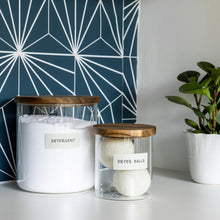 Load image into Gallery viewer, glass jars holding laundry detergent and dryer balls with white removable labels