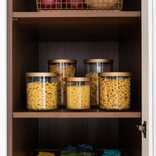 Load image into Gallery viewer, grouping of clear canisters with gold lids in pantry holding dried pasta
