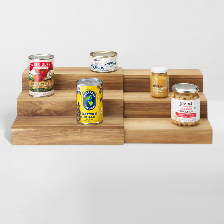 acacia wood expandable riser holding pantry food items