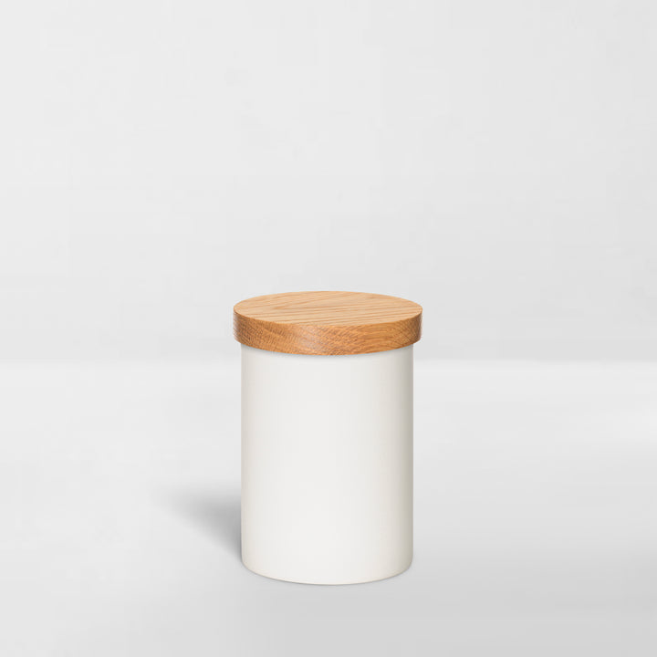 white ceramic jar with wood lid for organizing bathroom toiletries