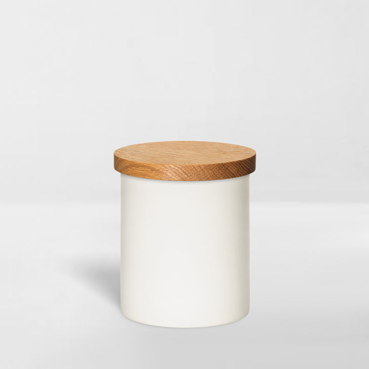 white ceramic jar with wood lid for organizing bathroom toiletries