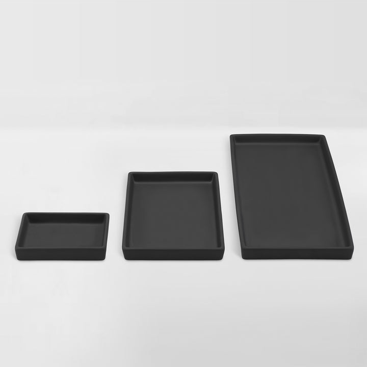 set of black ceramic trays for organizing