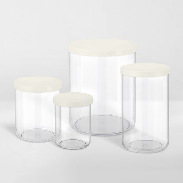 grouping of transparent storage canisters with white lids