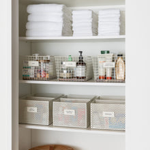 Load image into Gallery viewer, bathroom storage shelving with white metal baskets and white removable labels
