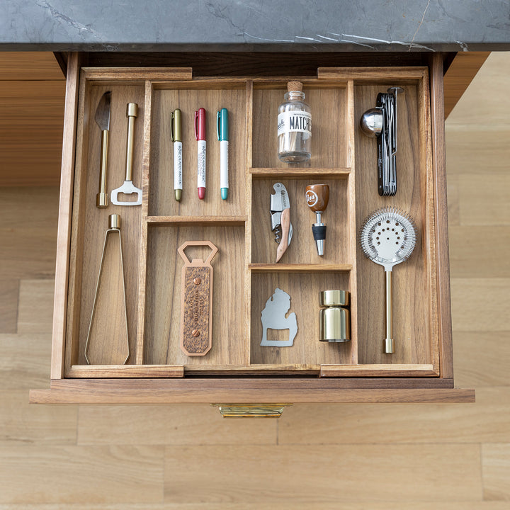 expanded acacia drawer insert in kitchen drawer with bar tools
