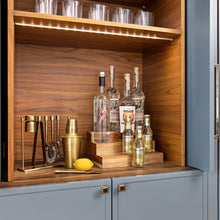 Load image into Gallery viewer, acacia wood expandable riser in cabinet holding bottled liquor

